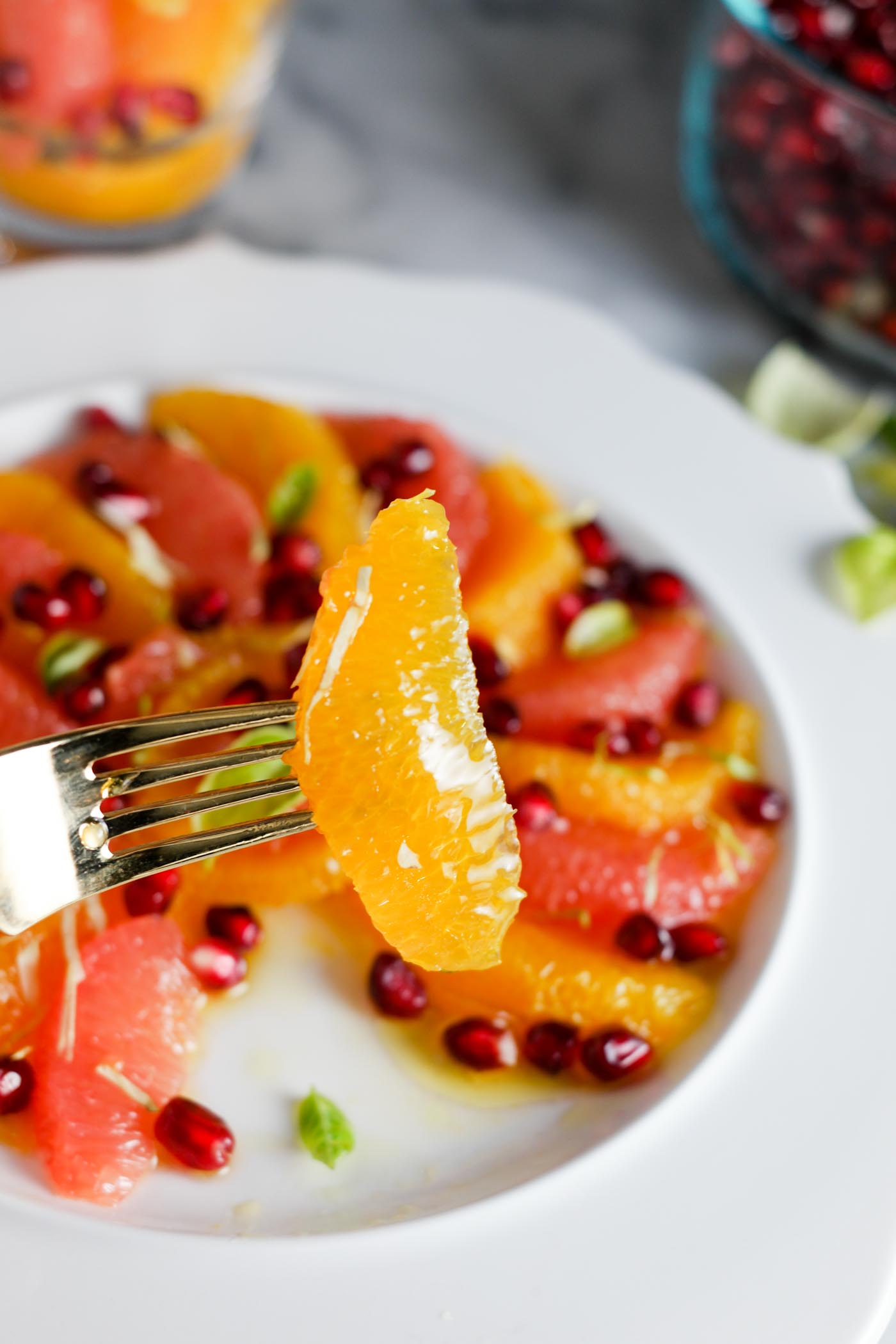 this quick & easy fruit salad is super wintery! Sweet... yet savory with a tiny dizzle of olive oil. a BEAUTIFUL side for the holiday dinner table! | thepikeplacekitchen.com